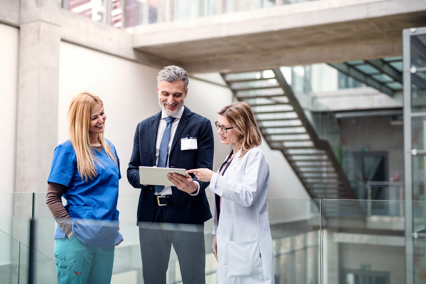 group-of-doctors-talking-to-pharmaceutical-sales-r-2023-11-27-05-30-45-utc