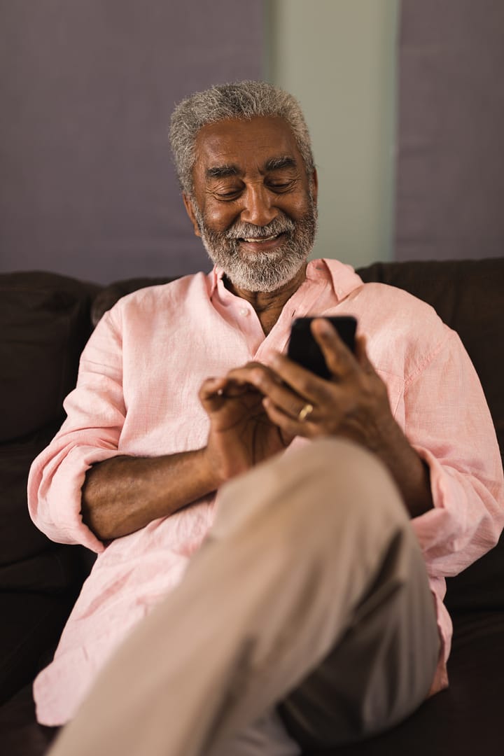 relaxed-senior-man-using-mobile-phone-at-home-2026-01-09-09-37-59-utc